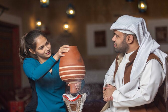 Interactive Saudi Cuisine and Cultural Experience - Wearing the shemagh and hama jewelry